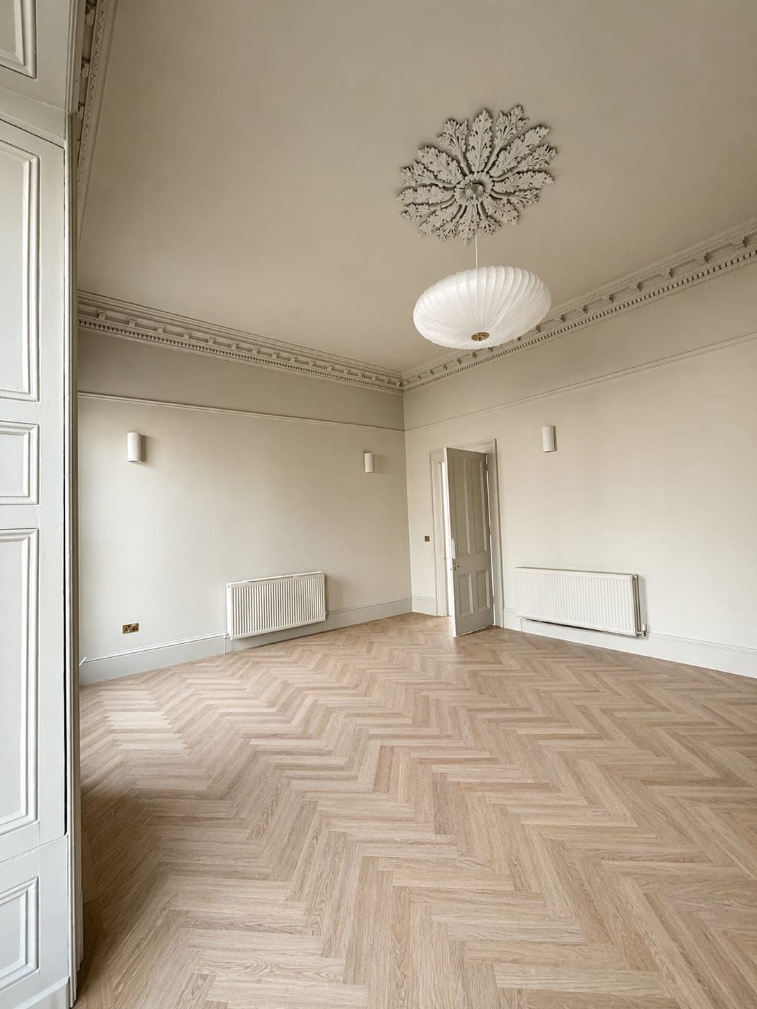 Period Dublin home after a completed rewire by Gorman Electrical Services — herringbone floor, pendant light and finished plaster